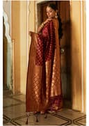 Woman wearing a maroon indian kurti for women by Nishtha Chadda