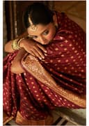 Woman wearing a maroon indian kurti for women by Nishtha Chadda