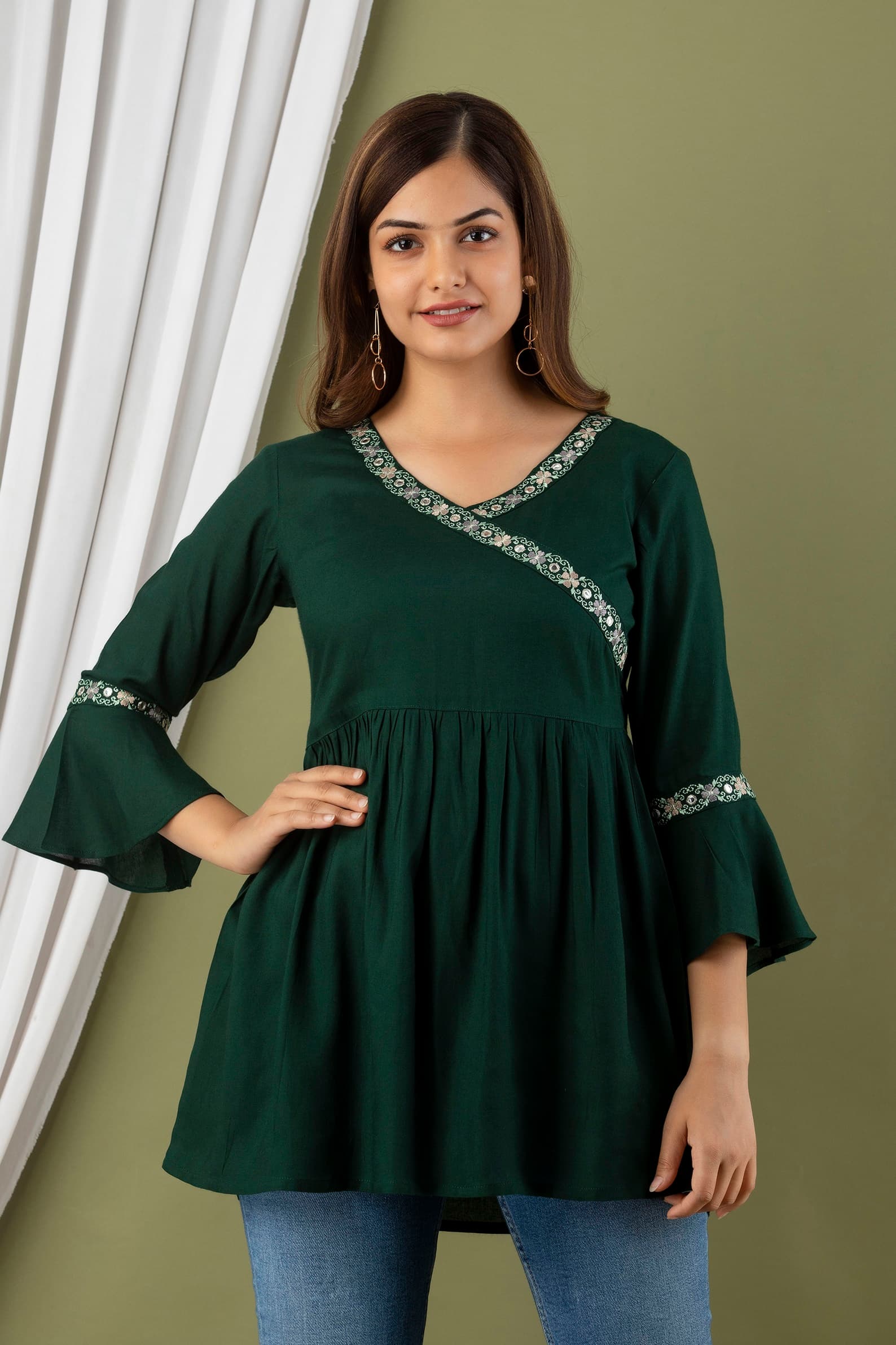 Woman wearing a olive tunic top for women by Nishtha Chadda