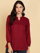 Woman wearing a maroon short kurti tunic top by Nishtha Chadda