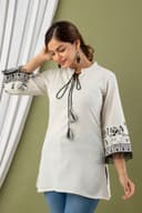 Woman wearing a orange tunic top for women by Nishtha Chadda