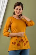 Woman wearing a orange tunic top for women by Nishtha Chadda