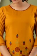 Woman wearing a orange tunic top for women by Nishtha Chadda