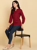 Woman wearing a maroon short kurti tunic top by Nishtha Chadda
