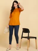 Woman wearing a navy tunic top for women by Nishtha Chadda
