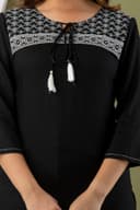 Woman wearing a olive tunic top for women by Nishtha Chadda