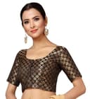 Woman wearing a brown party wear ethnic kurta style by Nishtha Chadda