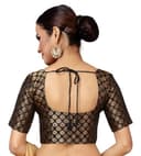 Woman wearing a brown party wear ethnic kurta style by Nishtha Chadda