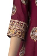 Woman wearing a maroon party wear ethnic kurta style by Nishtha Chadda