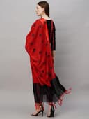 Woman wearing a red party wear ethnic kurta style by Nishtha Chadda