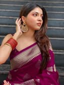 Woman wearing a maroon party wear ethnic kurta style by Nishtha Chadda