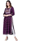 Woman wearing a maroon party wear ethnic kurta style by Nishtha Chadda