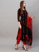 Woman wearing a maroon party wear ethnic kurta style by Nishtha Chadda