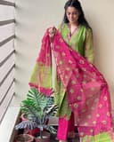 Woman wearing a red party wear ethnic kurta style by Nishtha Chadda