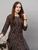 Woman wearing a brown party wear ethnic kurta style by Nishtha Chadda