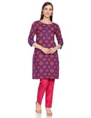 Woman wearing a red party wear ethnic kurta style by Nishtha Chadda