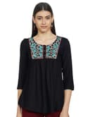 Woman wearing a grey party wear ethnic kurta style by Nishtha Chadda