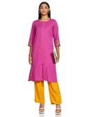 Woman wearing a coral party wear ethnic kurta style by Nishtha Chadda