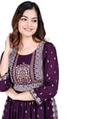 Woman wearing a maroon party wear ethnic kurta style by Nishtha Chadda