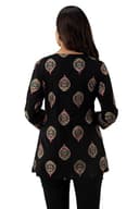 Woman wearing a maroon party wear ethnic kurta style by Nishtha Chadda