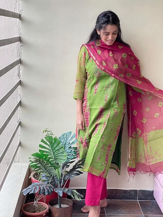 Woman wearing a brown party wear ethnic kurta style by Nishtha Chadda