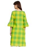Woman wearing a mustard party wear ethnic kurta style by Nishtha Chadda