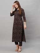 Woman wearing a brown party wear ethnic kurta style by Nishtha Chadda