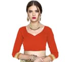 Woman wearing a red party wear ethnic kurta style by Nishtha Chadda