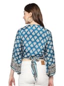 Woman wearing a teal party wear ethnic kurta style by Nishtha Chadda