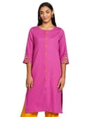 Woman wearing a pink party wear ethnic kurta style by Nishtha Chadda