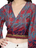 Woman wearing a red party wear ethnic kurta style by Nishtha Chadda