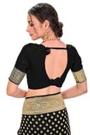 Woman wearing a beige party wear ethnic kurta style by Nishtha Chadda