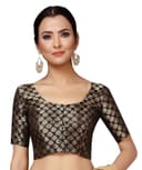 Woman wearing a brown party wear ethnic kurta style by Nishtha Chadda