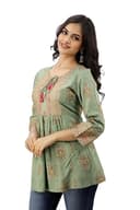 Woman wearing a grey party wear ethnic kurta style by Nishtha Chadda