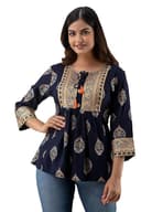 Woman wearing a brown party wear ethnic kurta style by Nishtha Chadda
