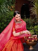 Woman wearing a red party wear ethnic kurta style by Nishtha Chadda