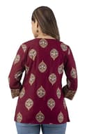 Woman wearing a maroon party wear ethnic kurta style by Nishtha Chadda