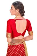 Woman wearing a red party wear ethnic kurta style by Nishtha Chadda