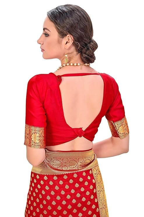 Woman wearing a red party wear ethnic kurta style by Nishtha Chadda