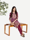 Woman wearing a brown party wear ethnic kurta style by Nishtha Chadda