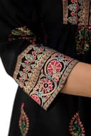 Woman wearing a brown party wear ethnic kurta style by Nishtha Chadda