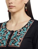Woman wearing a grey party wear ethnic kurta style by Nishtha Chadda