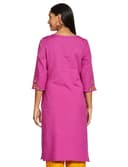 Woman wearing a pink party wear ethnic kurta style by Nishtha Chadda