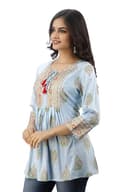 Woman wearing a grey party wear ethnic kurta style by Nishtha Chadda