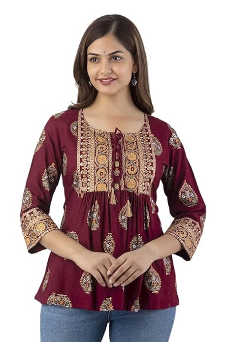 Woman wearing a maroon party wear ethnic kurta style by Nishtha Chadda