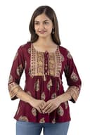 Woman wearing a maroon party wear ethnic kurta style by Nishtha Chadda