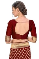 Woman wearing a maroon party wear ethnic kurta style by Nishtha Chadda
