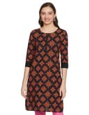 Woman wearing a brown party wear ethnic kurta style by Nishtha Chadda