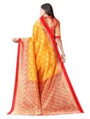 Woman wearing a orange party wear ethnic kurta style by Nishtha Chadda