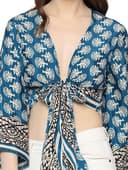 Woman wearing a teal party wear ethnic kurta style by Nishtha Chadda